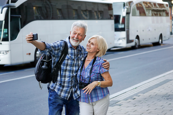 Couple Taking Selfie By Coaches Couple Taking Selfie By Coaches