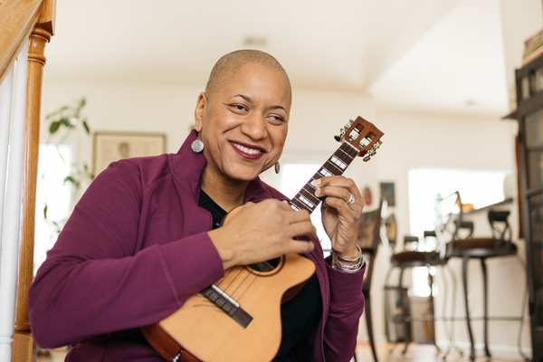 Senior Playing The Ukulele Senior Playing The Ukulele